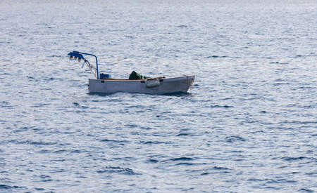small fishing boat alone in the sea