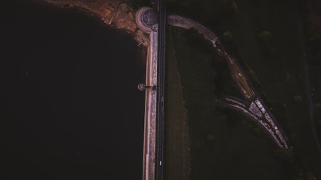 Aerial view from road between lake and landの写真素材