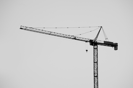Construction crane bottom view in operation with sky background. Black and White photo.の写真素材