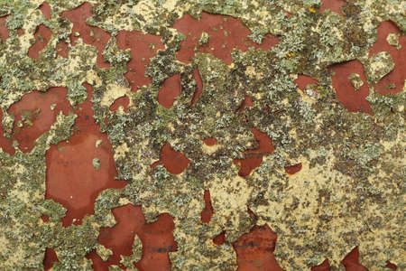 Rusty metal with peeling yellow paintの写真素材