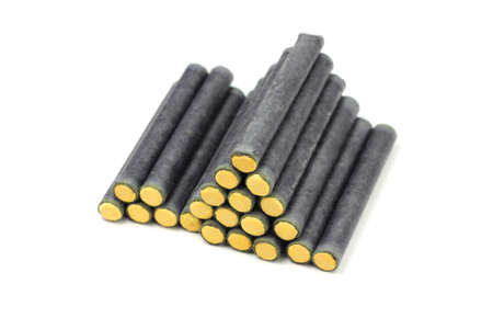 Several black firecrackers isolated on white background