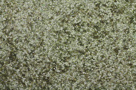 Flakes on an abstract background of smokeless powderの写真素材