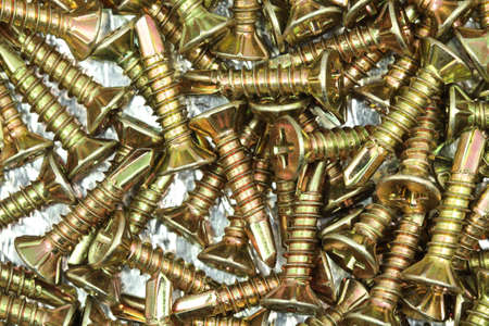 Anodized construction fasteners background closeupの写真素材