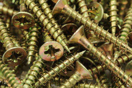 A long anodized screws closeupの写真素材