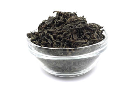 dried black tea leaves in a glass containerの写真素材