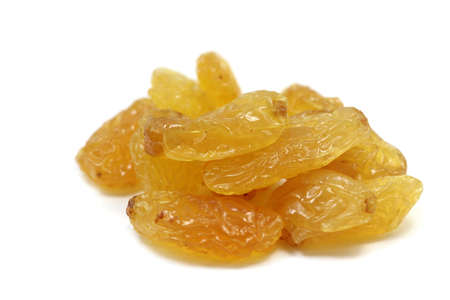 sweet yellow raisins closeup on white の写真素材