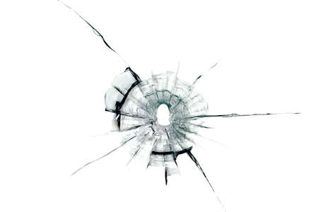 bullet hole in glass on white 