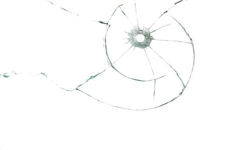 Bullet hole in glass on white backgroundの写真素材