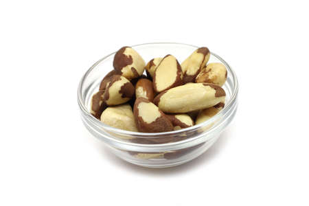 Brazil nut kernel in a glass on a white background の写真素材