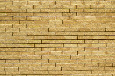 Yellow brick wall abstract background の写真素材