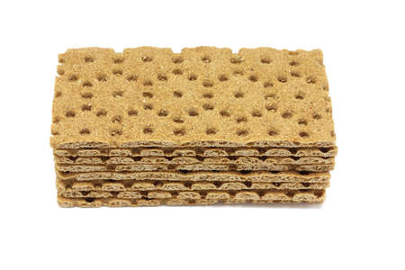 several brown loaves of bran on white backgroundの写真素材