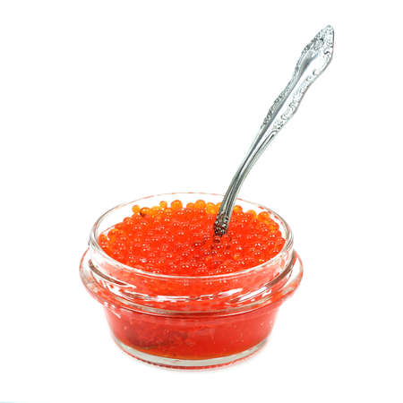jar with red caviar and spoon on a white backgroundの写真素材