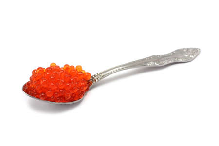 tablespoon with red caviar on a white backgroundの写真素材
