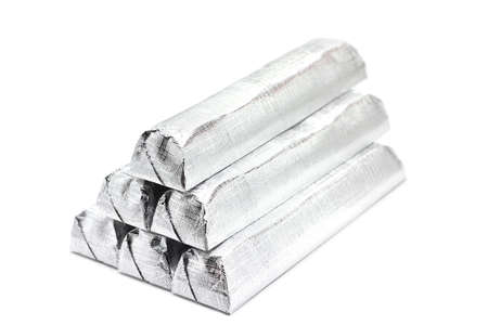 chocolates in shiny wrapper on a white backgroundの写真素材