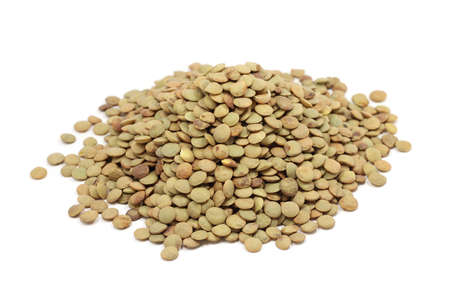 Ripe grains of lentils on a white backgroundの写真素材