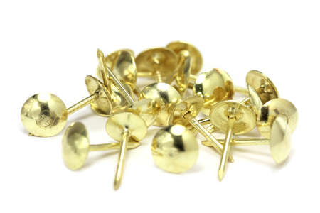 bronze decorative nails on a white backgroundの写真素材