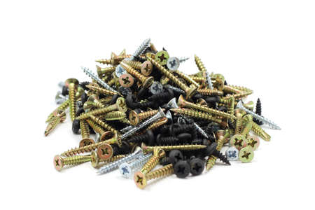 anodized handful of screws on a white backgroundの写真素材