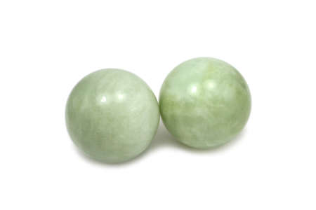 green stone spheres on a white backgroundの写真素材