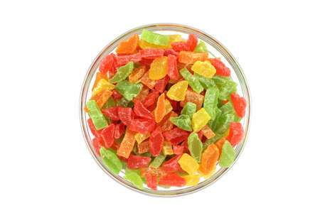 pieces of marmalade in a glass container on a white backgroundの写真素材