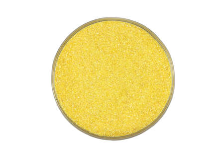 Corn flour in a glass on a white backgroundの写真素材