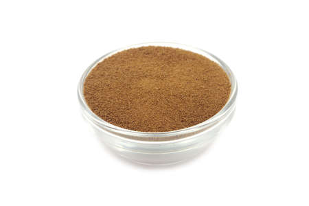 dry soluble coffee powder in a glass containerの写真素材