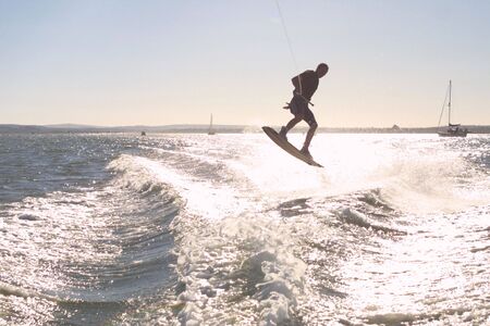 catching air while wakeboardingの写真素材