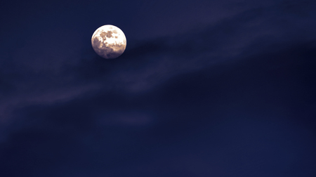 a white moon in the blue skyの写真素材