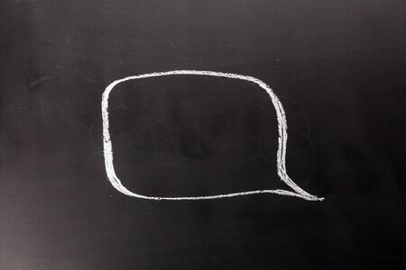 Spech bubble on the chalk boardの写真素材