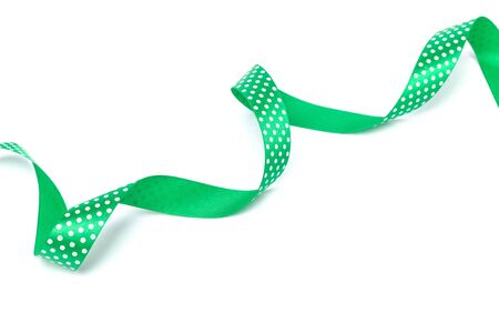 a green ribbon isolated on white backgroundの写真素材