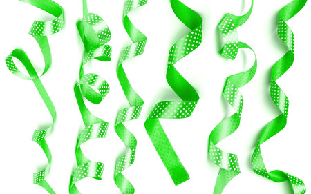 a green ribbon isolated on white backgroundの写真素材