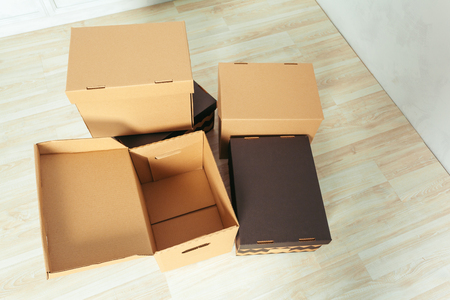 Big cardboard boxes standing insinde a room