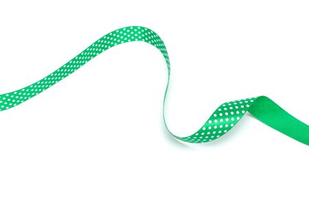 a green ribbon isolated on white backgroundの写真素材
