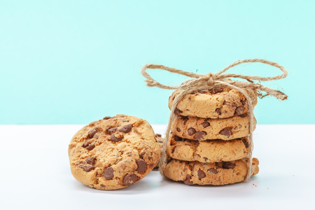 chocolate chunk cookies on a bright blue backgroundの写真素材