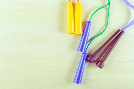 Sports equipment on wooden floorの写真素材