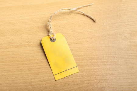 Blank tag on wooden backgroundの写真素材