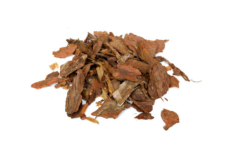 heap of pine bark isolated