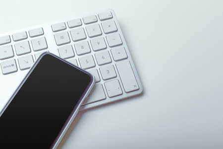 Close up image of computer office keyboard on a white backgroundの写真素材