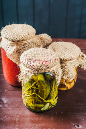 Preserved vegetables on wooden backgroundの写真素材