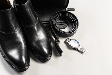 shoes and accessories for men lay on the wooden floorの写真素材