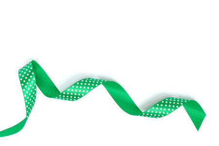 a green ribbon isolated on white backgroundの写真素材
