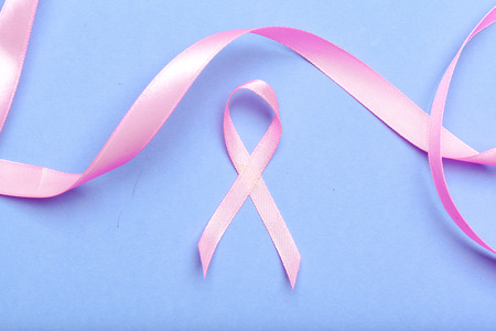 ribbon HIV, AIDS on blue background