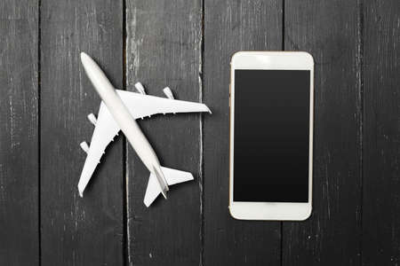 Model airplane on the wooden background
