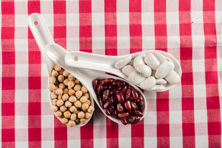 mix of beans on wooden table