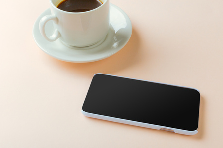 smartphone and coffee on the table