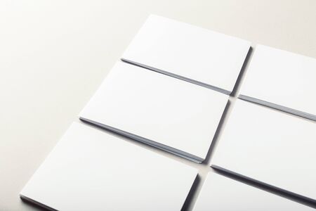 blank business cards on grey background