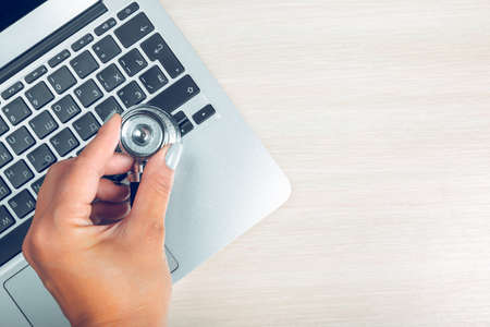 Stethoscope on laptop, close-upの写真素材