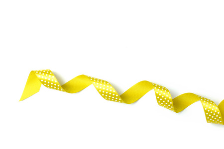 Yellow ribbons isolated on whiteの写真素材