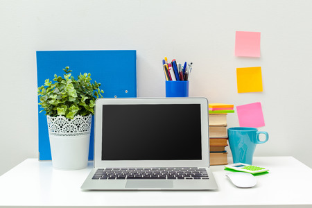 Work place of a creative person with a variety of colorful stationery objectsの写真素材
