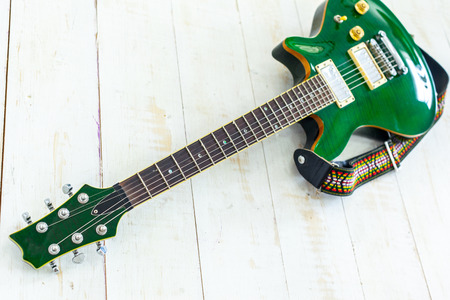 Electric guitar on old wooden surfaceの写真素材