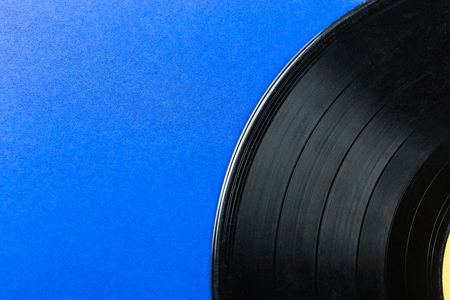 Retro vinyl record on blue backgroundの写真素材